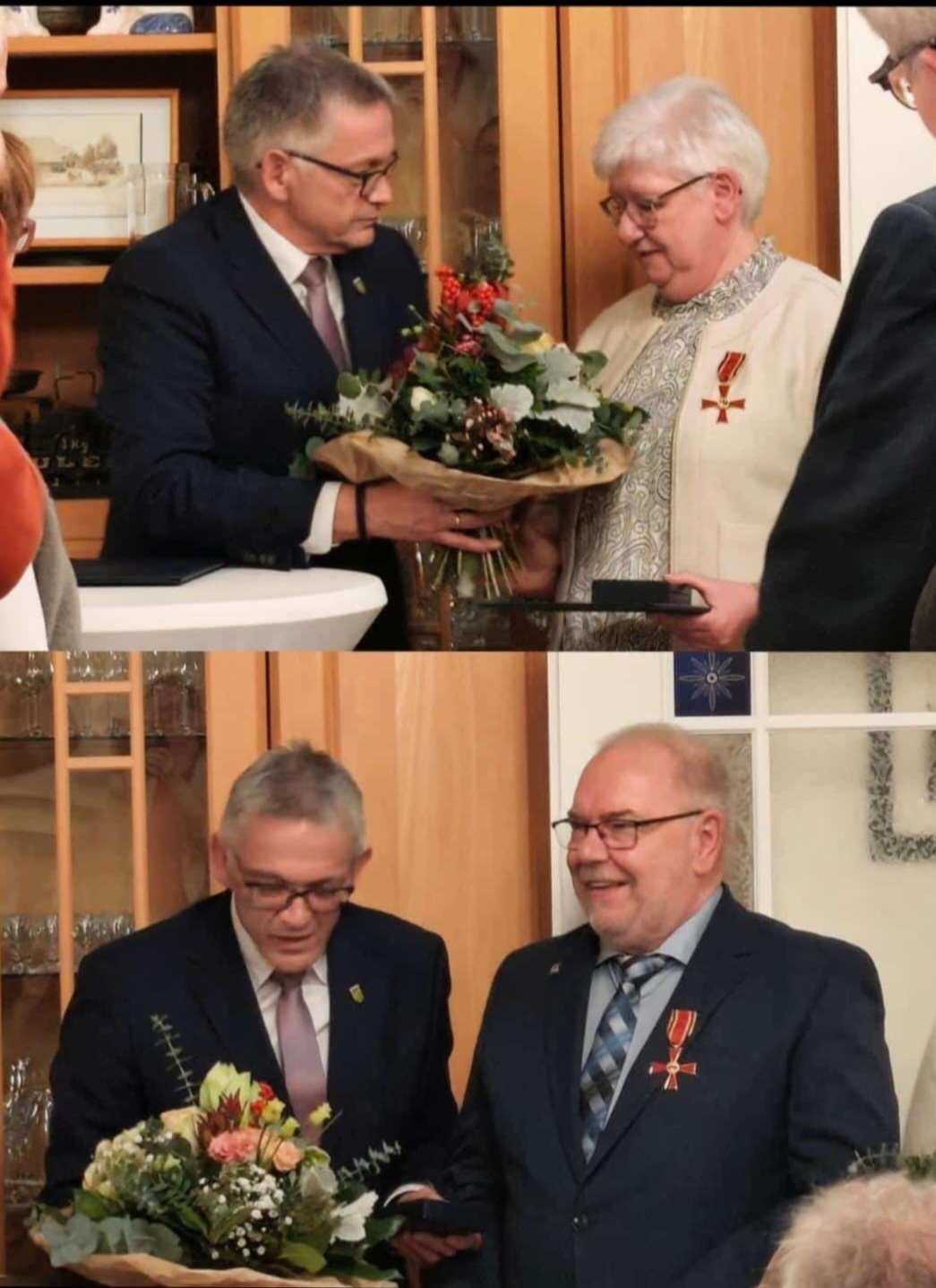 Landrat Meinen überreicht die Urkunde und die Orden